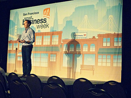 David Silverglide up on stage of San Francisco Small Business Week, presenting on the benefits of being a cashless business.