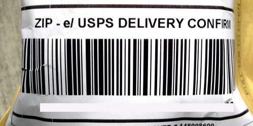 Image of a barcode on a rounded or curved shipping label